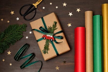 christmas background with gift boxes and rolls of 2023 11 27 04 54 36 utc scaled 1