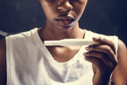 closeup of black woman with pregnancy test in a ha 2023 11 27 04 56 22 utc