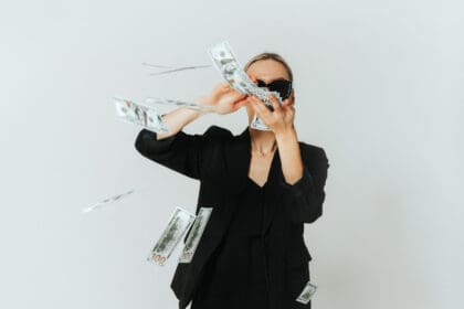 woman throwing money around lottery winner with b 2023 12 06 03 39 25 utc scaled e1705503103574