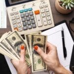 close up hands counting money