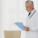 doctor writing clipboard