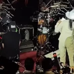 Christian Nodal en el escenario durante un concierto.